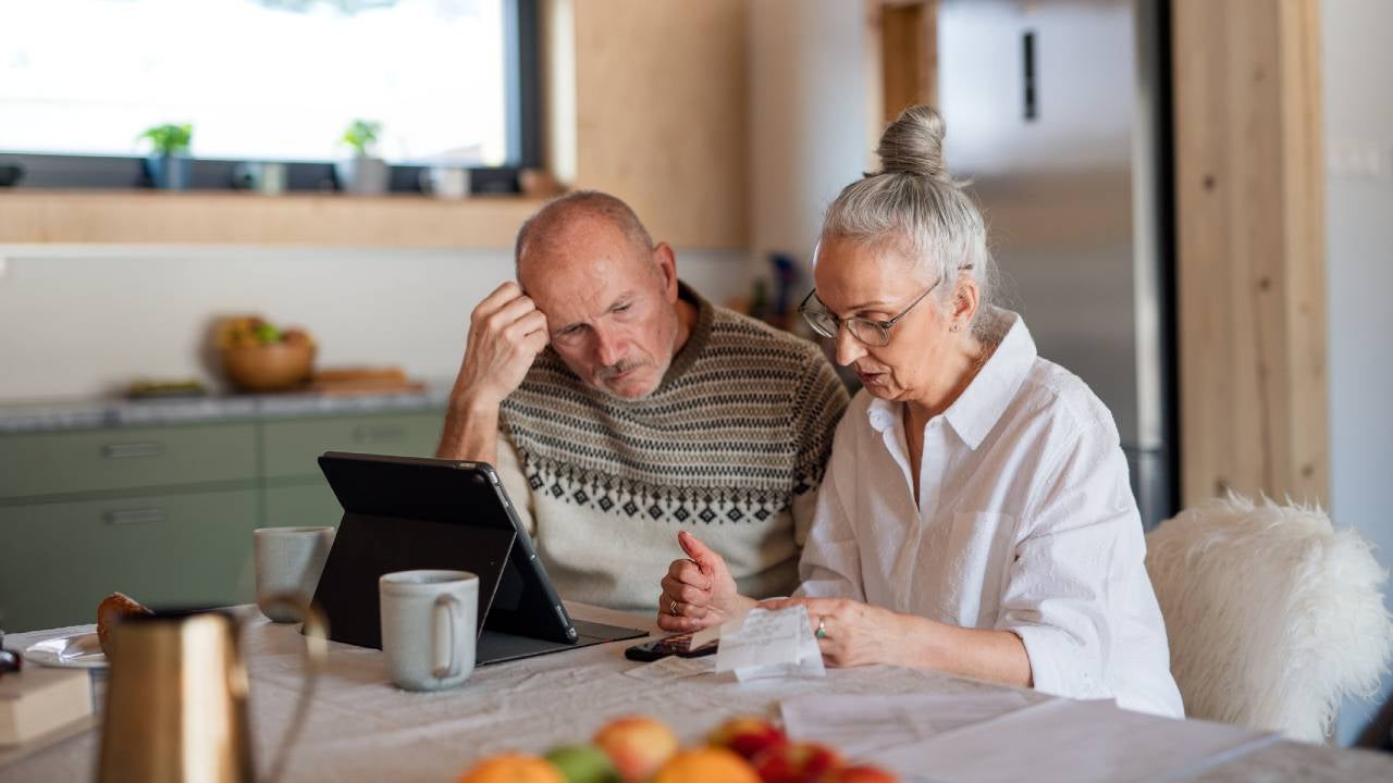 Senior couple sitting at the kitchen table