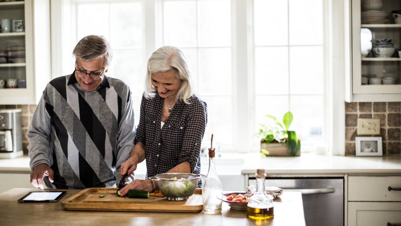 Senior couple preparing dinner