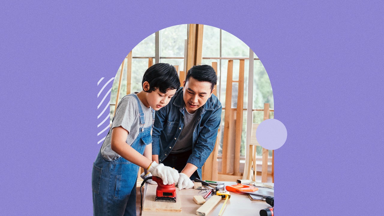 A boy and a man working together on a construction project