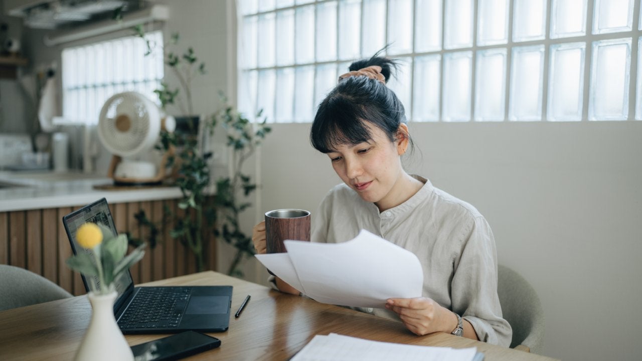 Asian women working with invoices