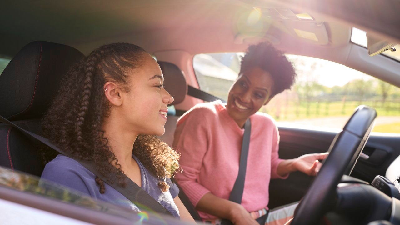 teenage girl in car with her parent