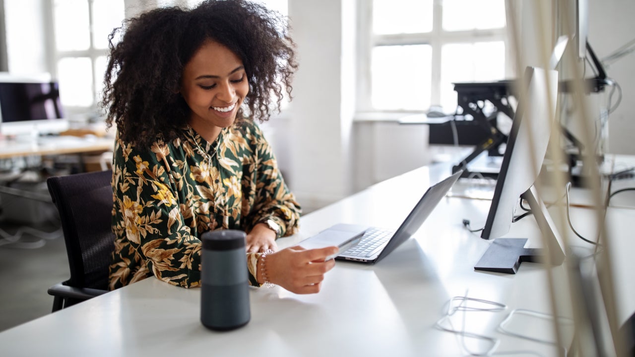 Woman using wireless technology for online shopping