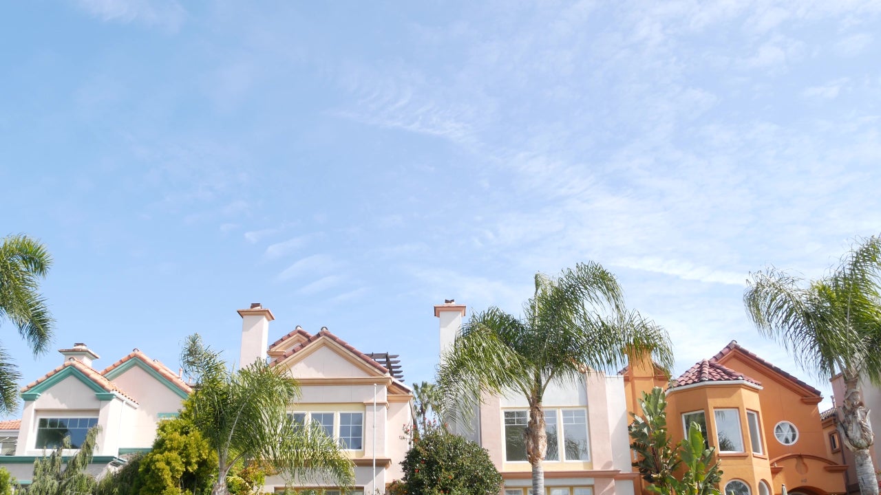 California typical suburban street, tropical Oceanside USA. Different colorful houses row