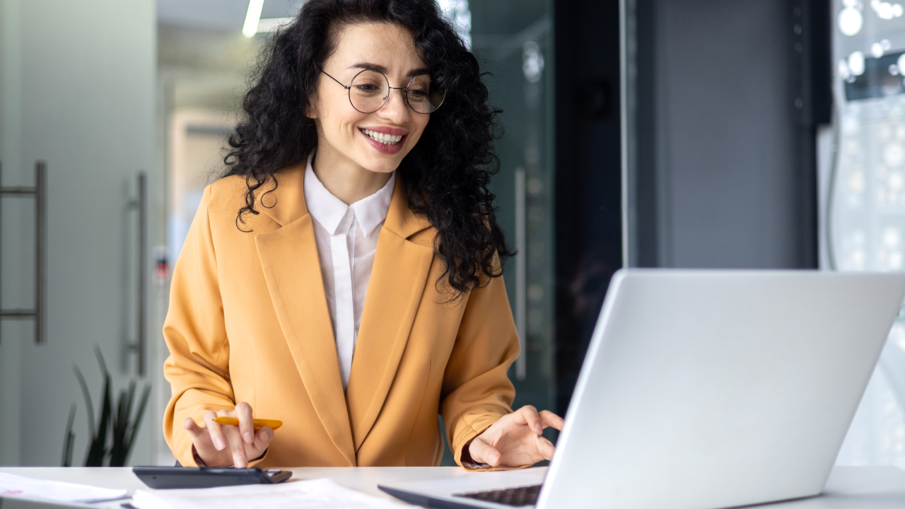 Mature successful financier accountant on paper work with papers, documents contracts and charts graphs, businesswoman boss with calculator smiling happy with achievement results, inside office.