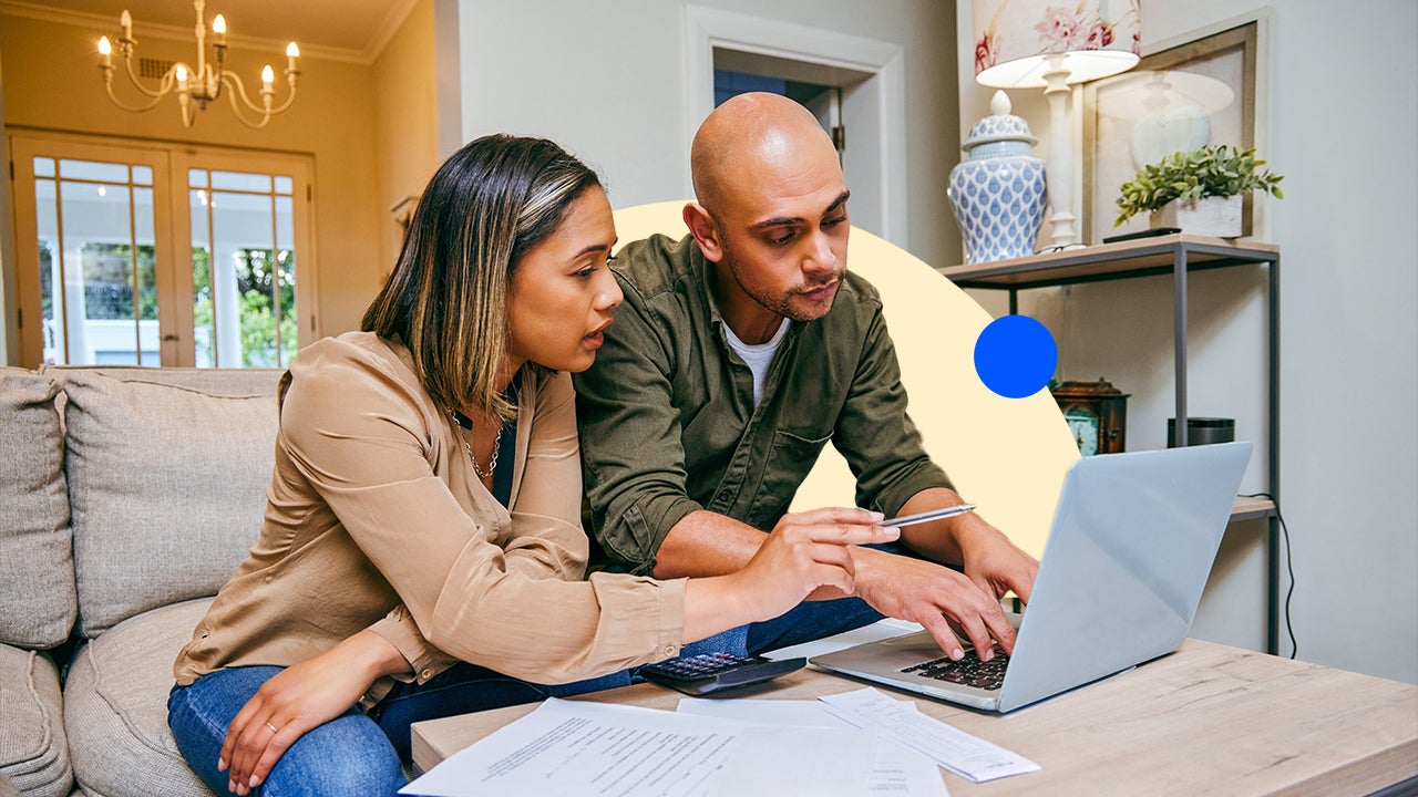 Two people working together on a laptop