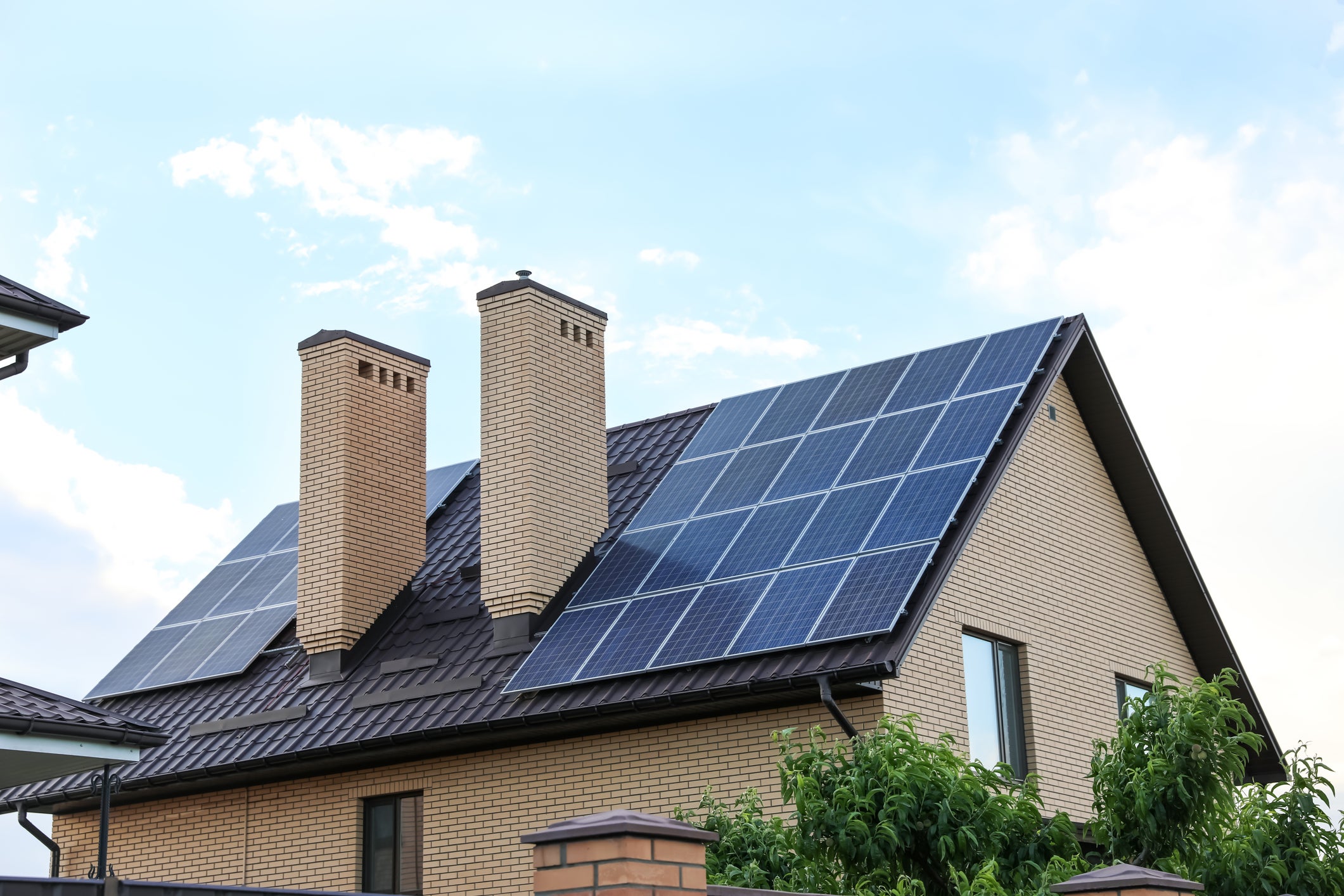 Home with solar panels installed on the roof .