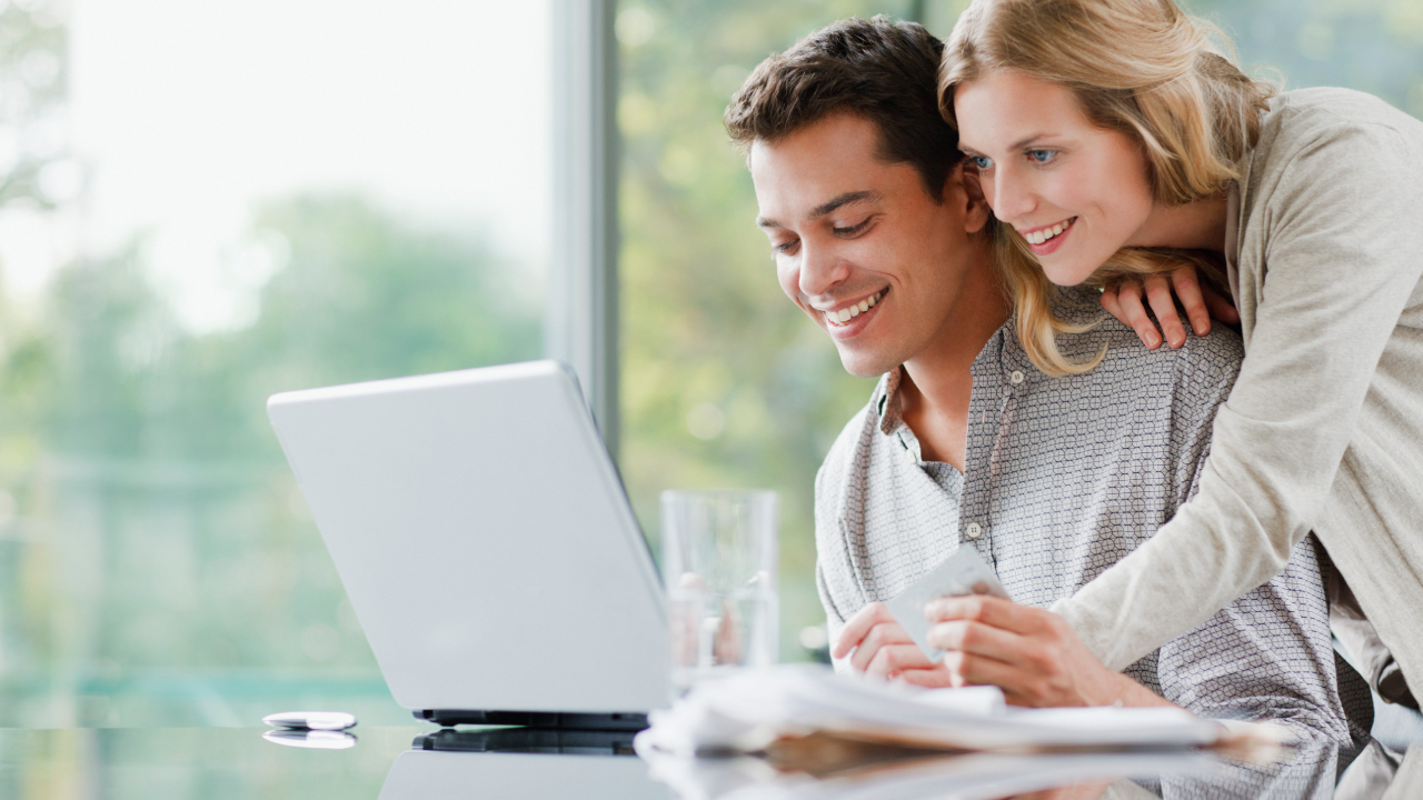 Couple shopping online with credit card