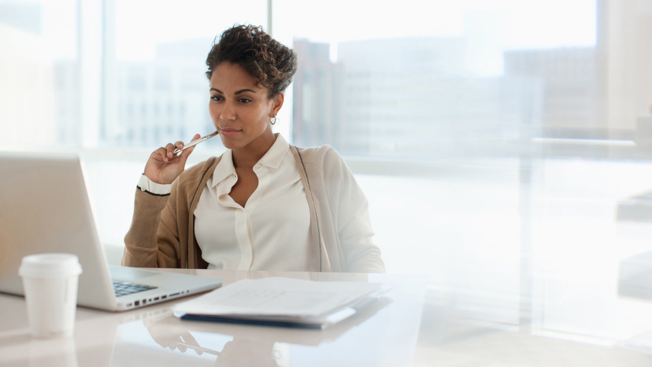 Businesswoman using laptop in office