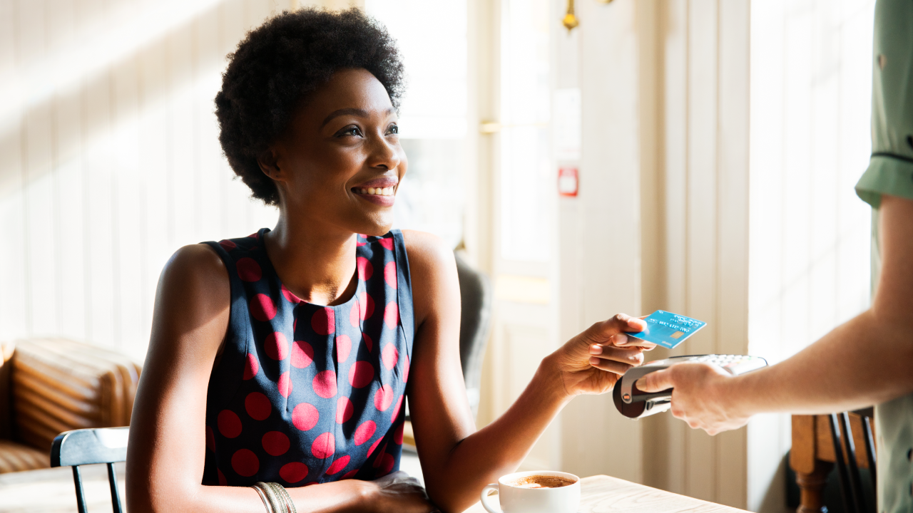 Woman using contactless payment - stock photo