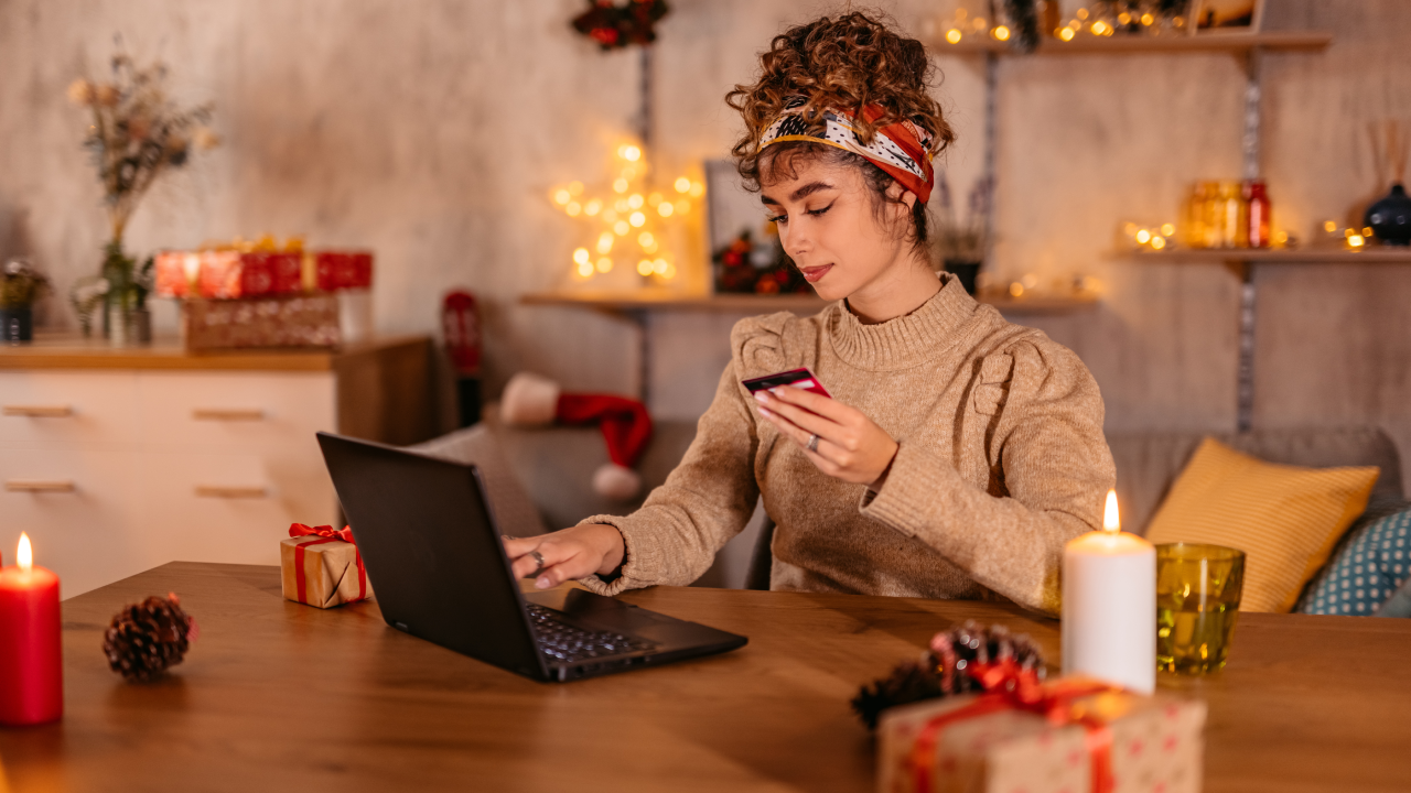 young woman shopping online at home during Christmas holidays