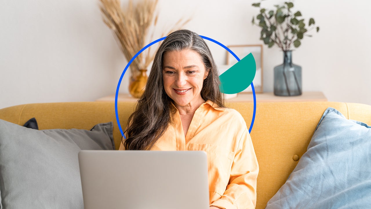 Woman accessing her checking account at home on a laptop