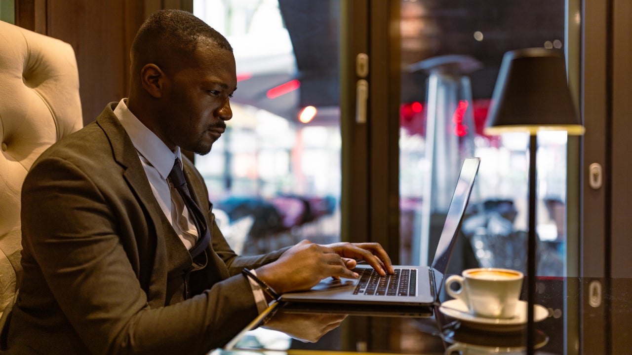 A businessman doing financial planning on a laptop