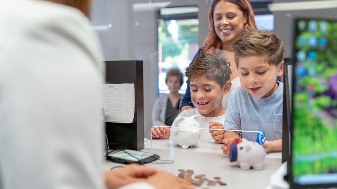 Mom teaching her sons about financial responsibility