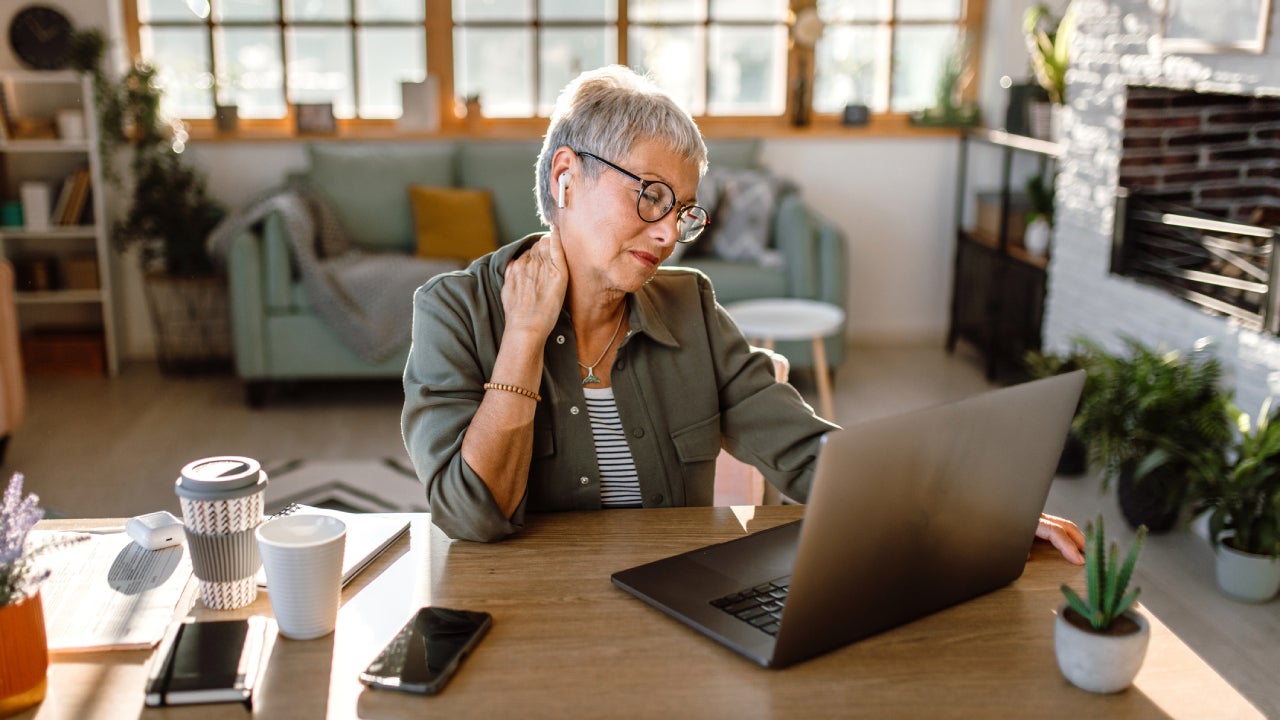 Senior woman overworking at home