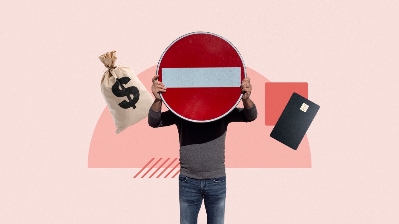 Man blocking face by holding a stop sign in front of himself