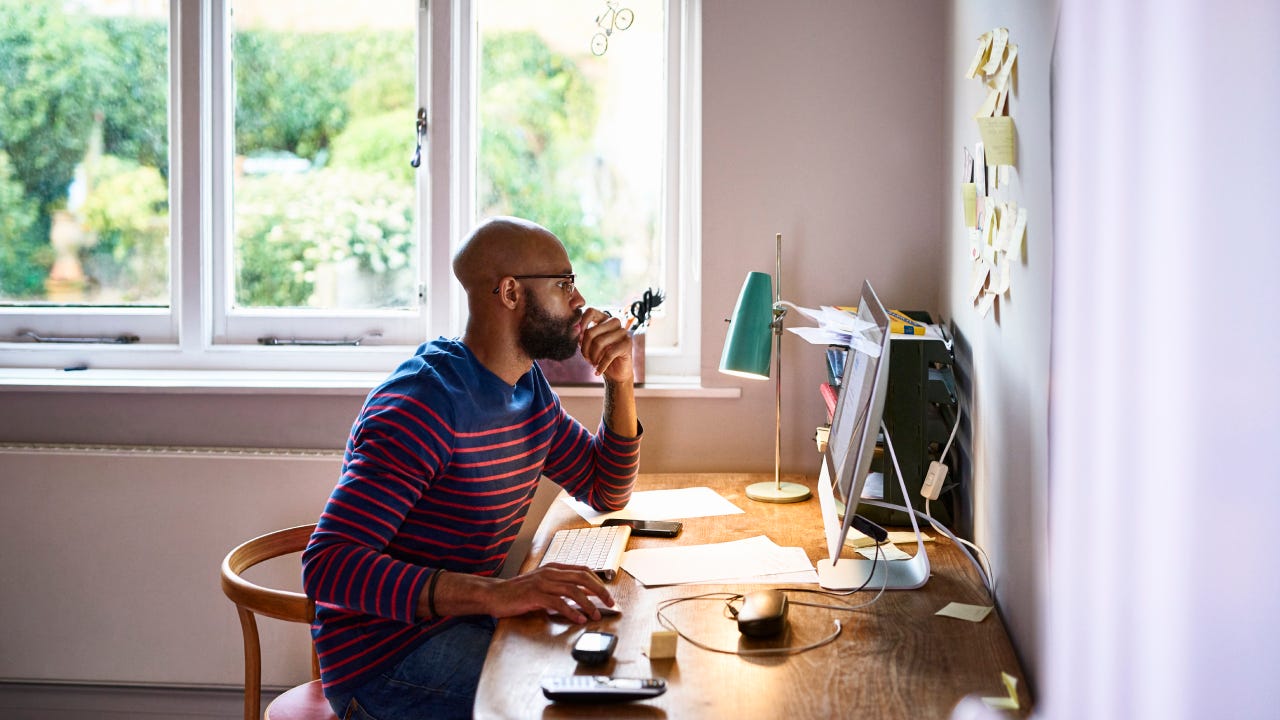 Man using computer in home office