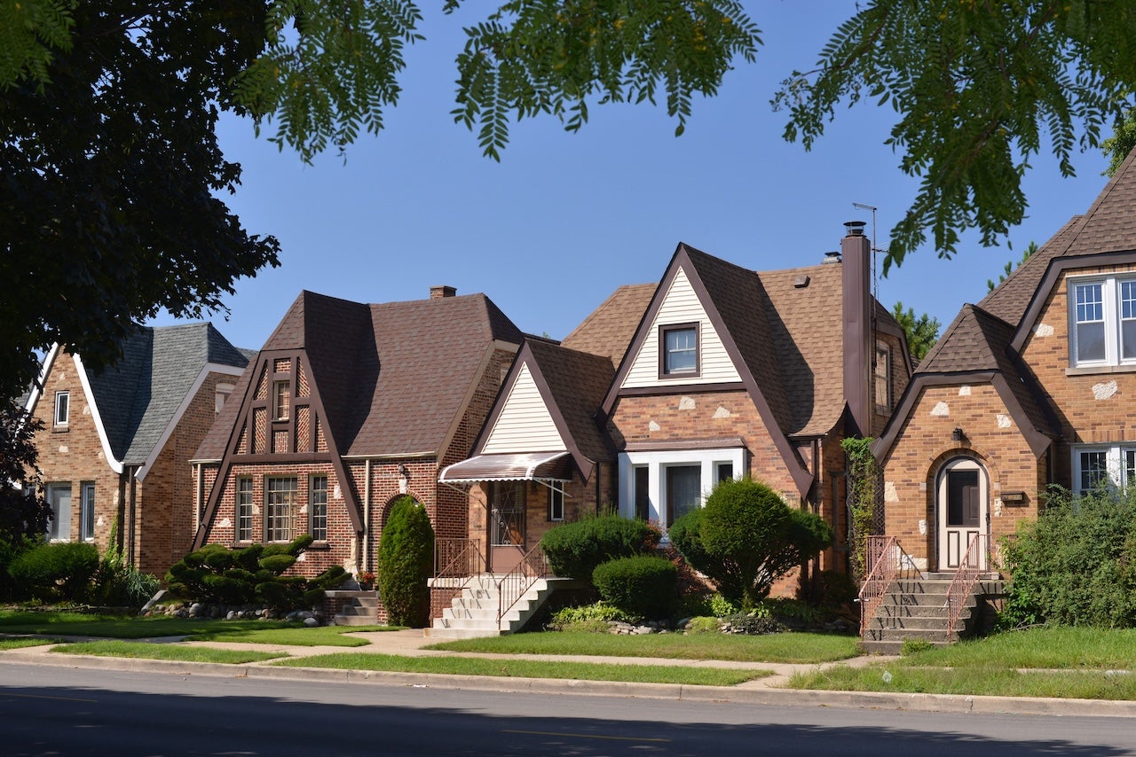 row of small tudor homes in suburban chicago