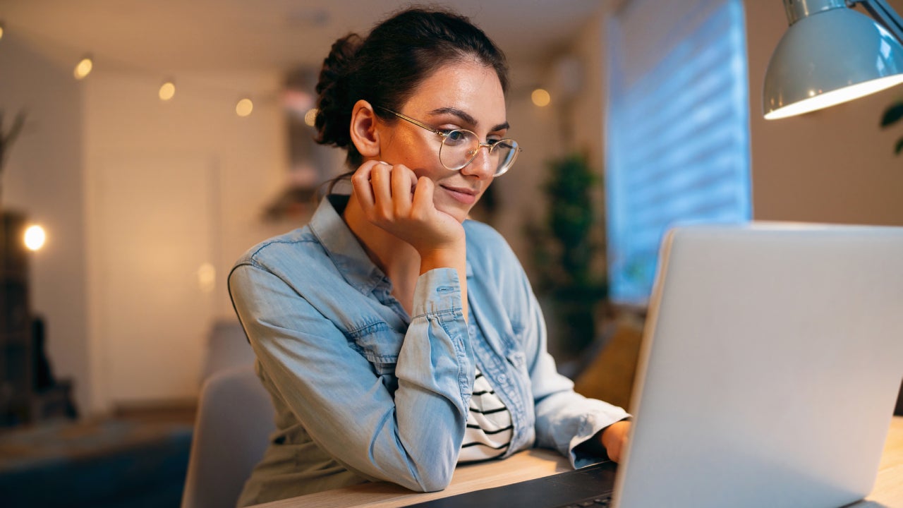 woman, using laptop while working from home