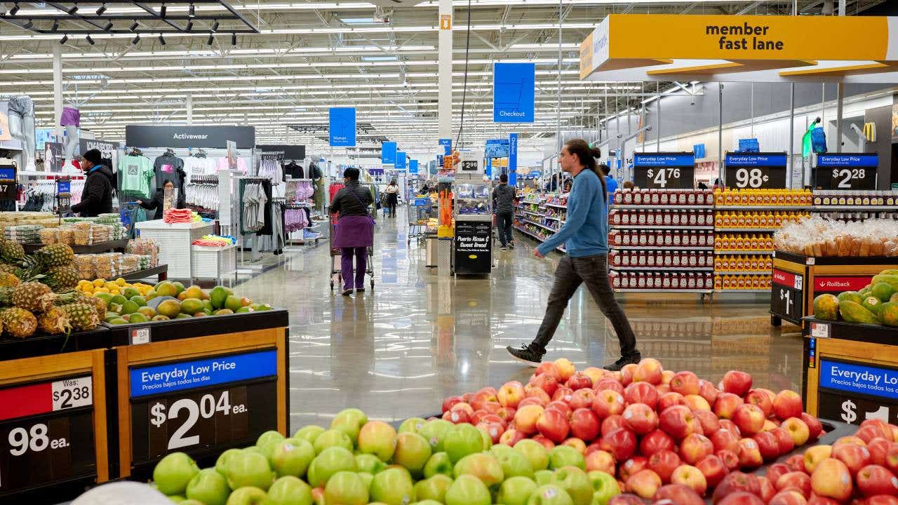 Man walking through Walmart produce section