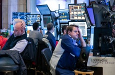 Traders work on the floor of the New York Stock Exchange