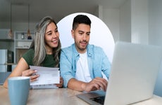 Young couple paying bills online