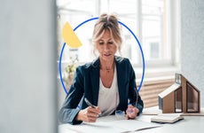 real estate agent going over paperwork at table