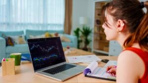 Woman is checking stock market price chart