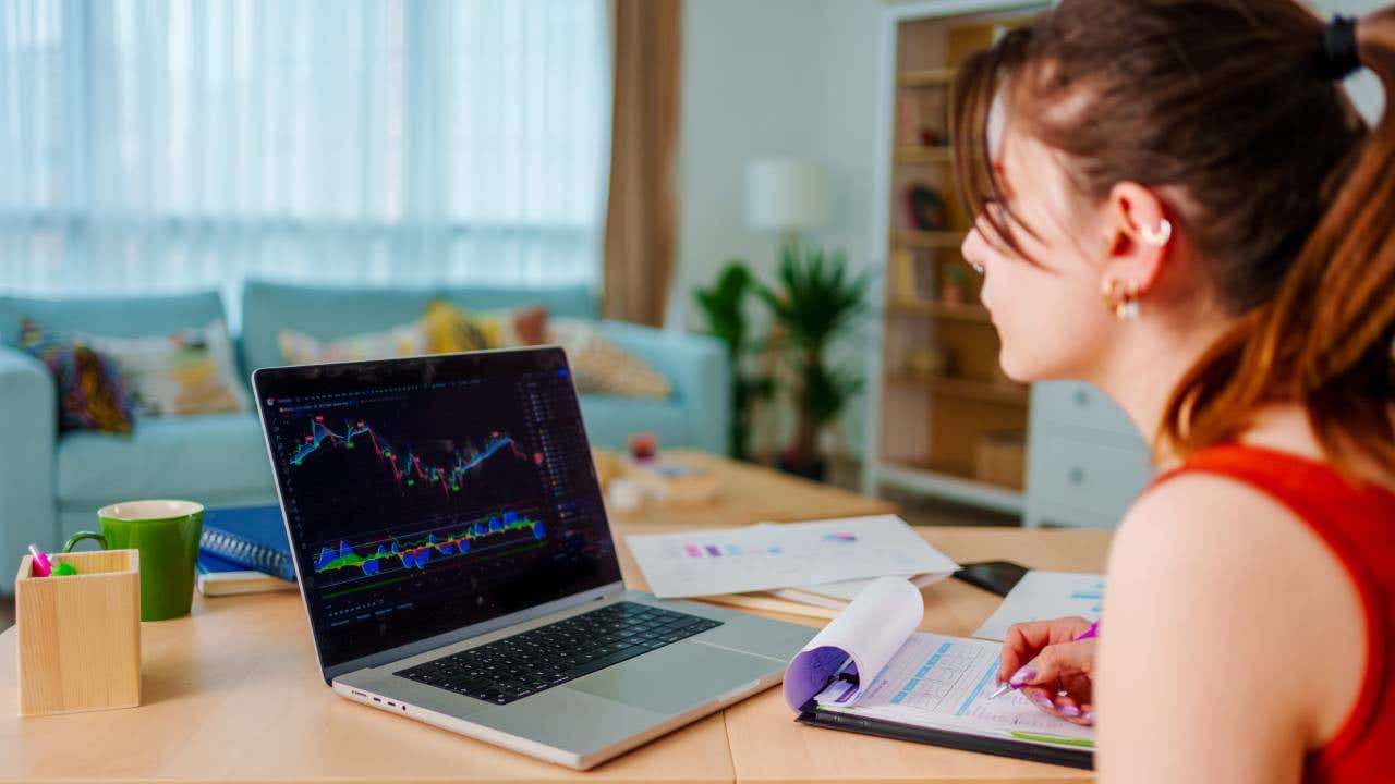 Woman is checking stock market price chart