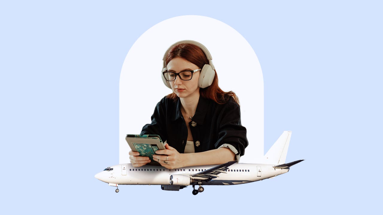 Young woman with headphones looks at smartphone with airplane beneath her.