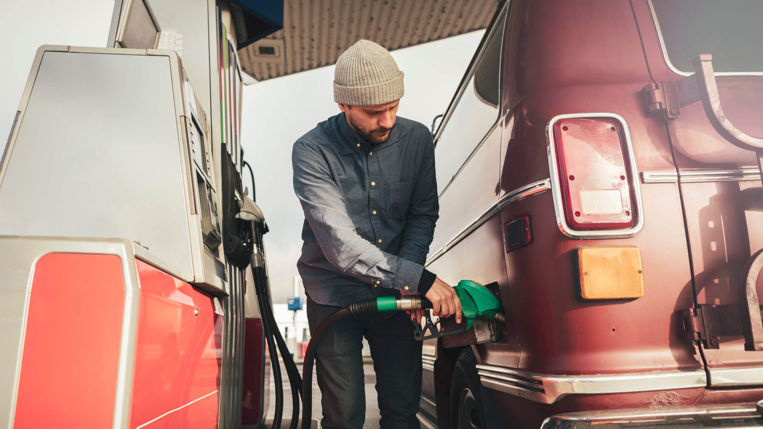 Man pumping gas