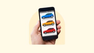 an image of multiple cars on a phone being held up