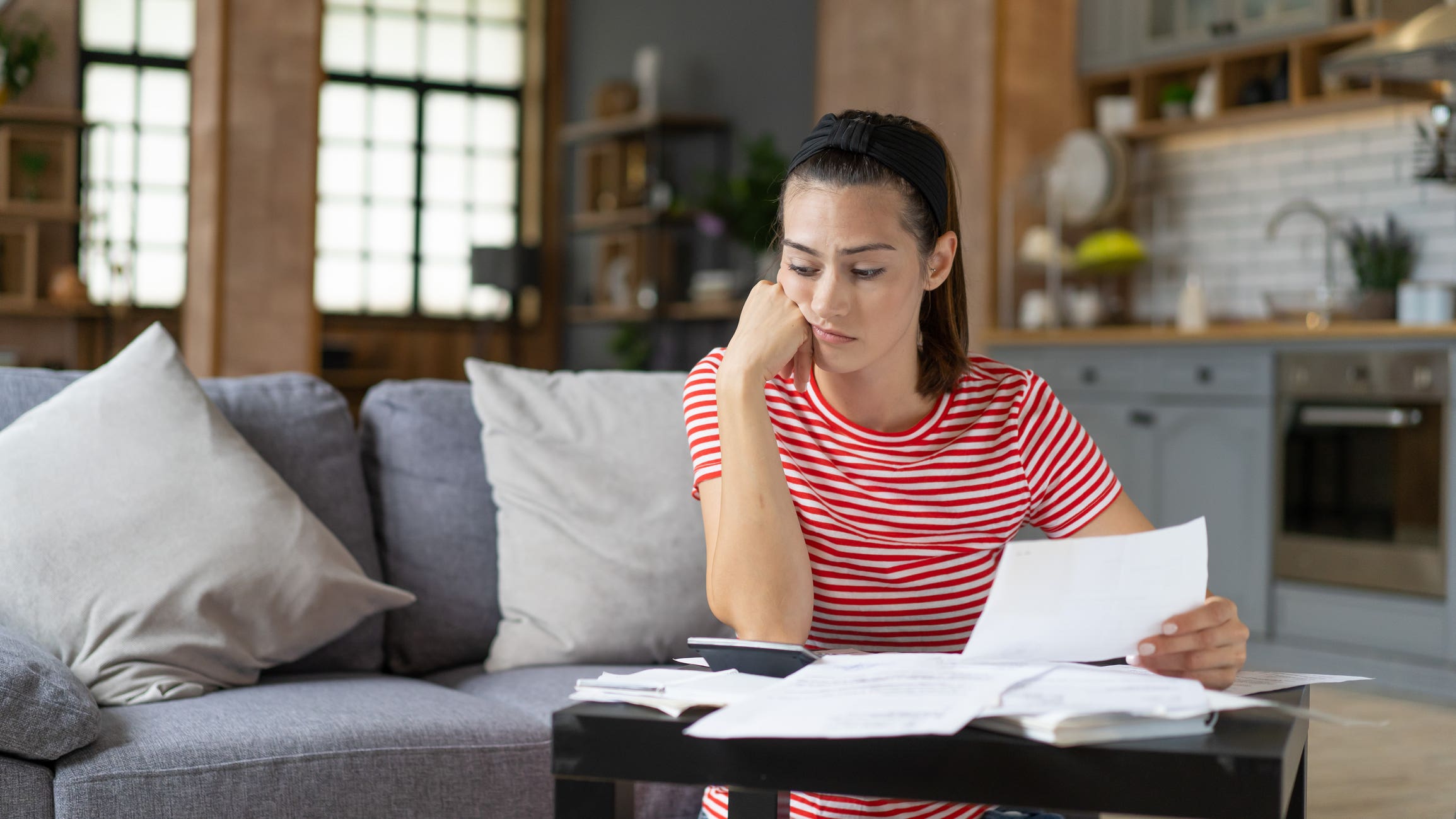 Woman contemplates finances