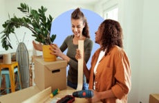 woman and realtor working on setting up new house