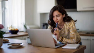 woman using a laptop at home