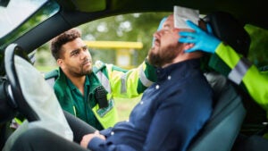 EMTs helping someone