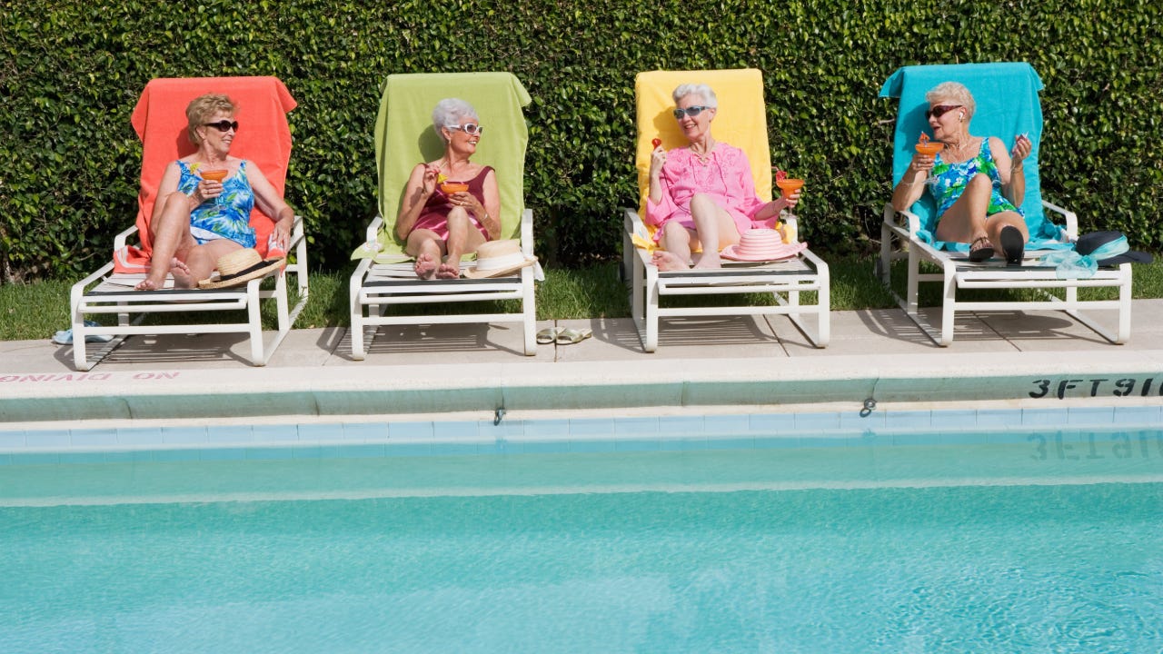 Senior Friends Poolside with Drinks