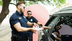 two police officers pulling over a driver