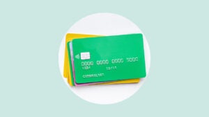 A pile of credit cards on a graphic background