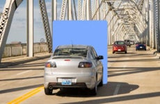 Car driving on a bridge