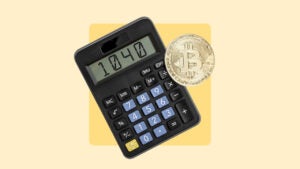 Calculator next to an illustration of a Bitcoin token.