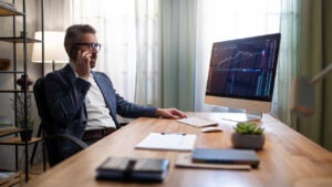 Mid adult business man working alone in his office