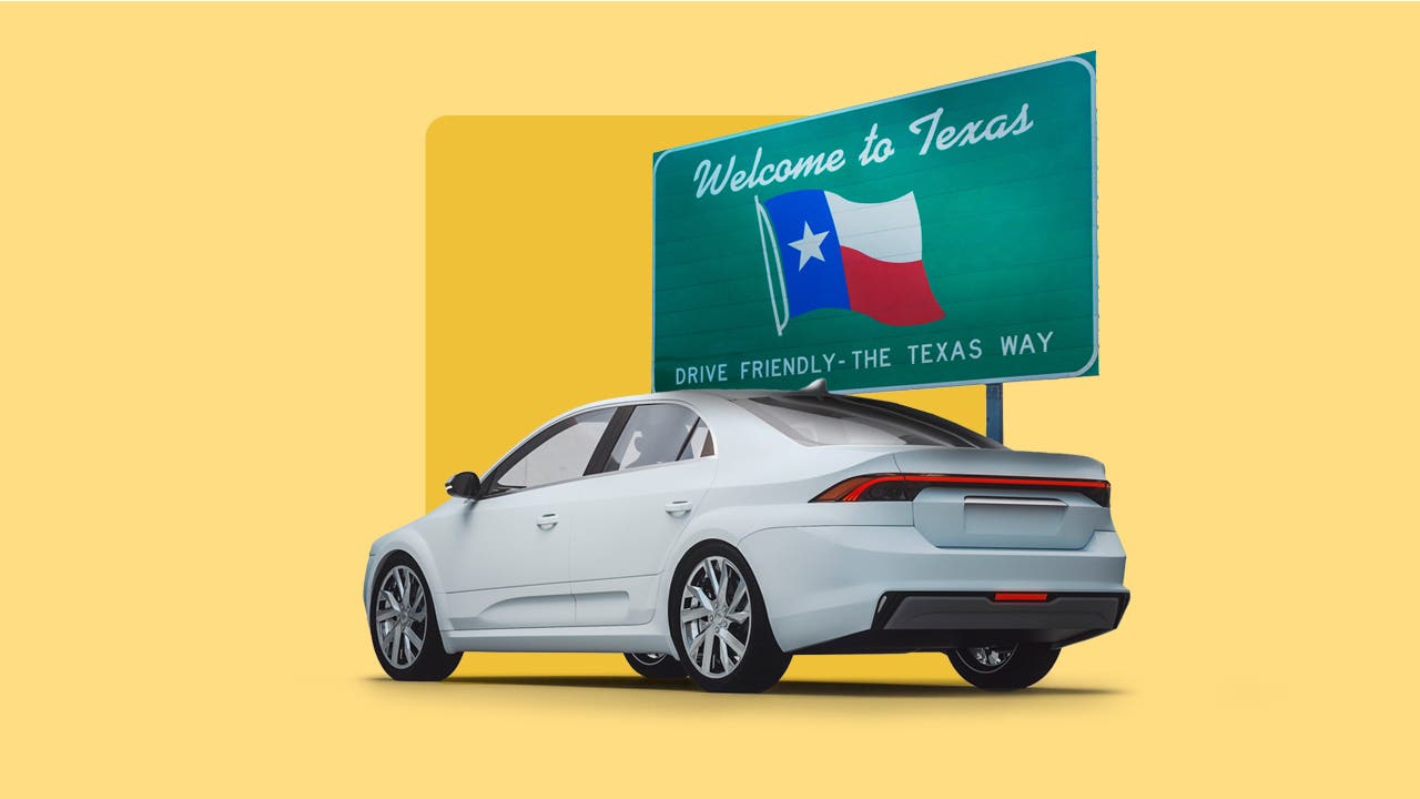 A car parked in front of a Texas sign