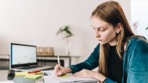 Young woman studying at home