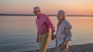 A senior couple enjoying summer vacation by the sea