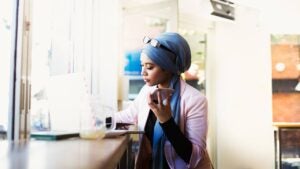 Young Muslim Woman Working in Cafe