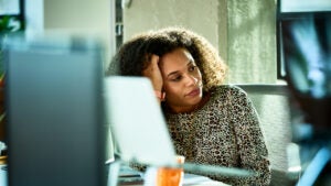 woman looking bored at desk