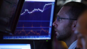 Traders work on the floor of the New York Stock Exchange