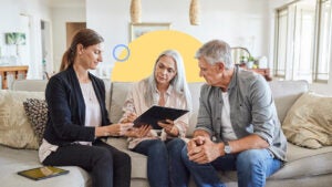 couple going over closing statement with realtor