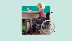 Woman in wheelchair using a laptop