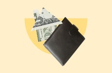 Image of a wallet with a $1 bill folded to look like a house